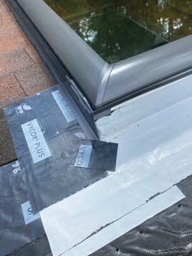 Metal step flashing that’s supplied with the skylight manufacturer’s installation kit is installed along with each shingle course. To provide for good drainage, I cut the shingles short to leave a 1/2-inch gap between them and the step flashing around the skylight curb. At the top corners, I seal the last step flashings to the shingles beneath with Vycor.