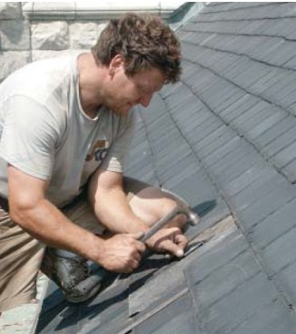 A slate hook driven into the roof will hold the bottom of the replacement slate.