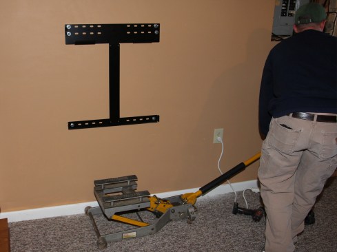 The Powerwall mounting bracket bolts to the wall studs.