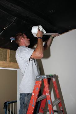 On ceilings, a tough cord-reinforced tape is applied on top of the regular Sound Barrier tape.