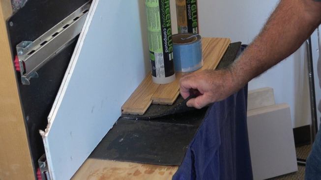 On walking surfaces, QuietWalk is installed under tile or wood flooring.