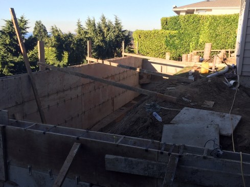 Here the retaining walls have been formed and are ready to be filled with concrete.