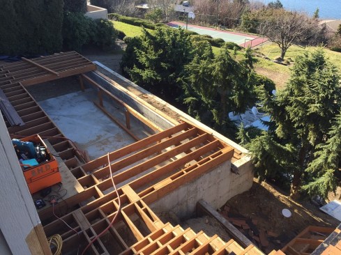 Since the spa bears on the slab rather than the framing, the deck was built with standard PT lumber and deck details.