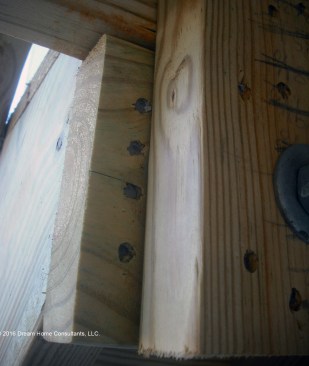 Attaching stringers to a dropped header with nails as shown here is a risky fastening method because nails driven into lumber end grain have minimal resistance to withdrawal.