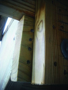 Attaching stringers to a dropped header with nails as shown here is a risky fastening method because nails driven into lumber end grain have minimal resistance to withdrawal.