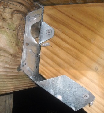 At a cost of a few dollars each for the connectors and recommended fasteners, the most cost effective way to hang a stringer is with metal hardware. But this one - a Simpson Strong-tie LSU26Z - has been installed incorrectly, since the stringer isn't fully bearing on the connector seat. Another red flag: drywall screws instead of approved connector fasteners have been used to fasten the connector to the framing.