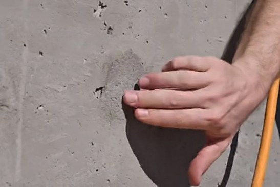 The first step in applying this material is to inspect the surface of the walls and fill any large voids with mortar.