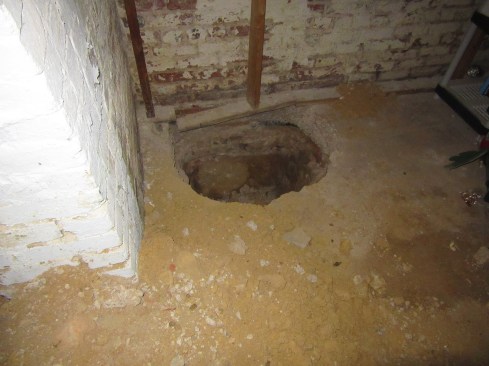 Before an engineering plan can be devised, the author’s company digs several inspection holes like this one to document how far the foundation extends and what the footing’s condition is.