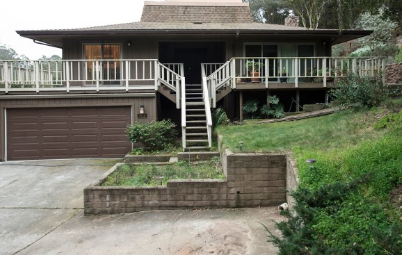 Problems with the existing deck included a narrow staircase, poor illumination, multiple levels, and a non-code-compliant guardrail that blocked the view.