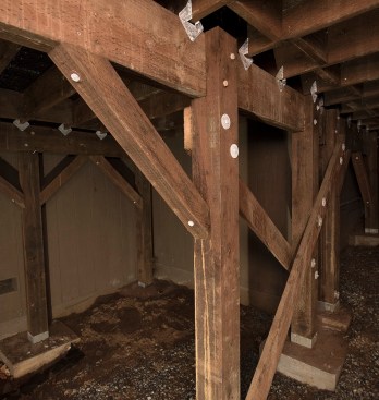 Except for slightly reduced joist and beam spans, standard deck framing is used to support the Silca Systems grating and stone pavers. The author included SST HD2A holddown connectors and robust cross bracing as a precaution against seismic activity.