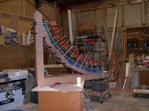 Now I could glue and clamp the finish faces to the inner curves, rout the edges flush, and fill the backs with glued-in MDO plywood. Ultimately, the engineered core material was completely encased in truly weatherproof material.
