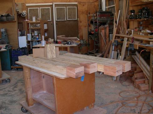 For the straight legs of the brackets, I cut 4x6 Parallams to length, then epoxied solid sapele blocks to the ends. This would simplify the veneering process because the finished ends would later be chamfered at 45 degrees.