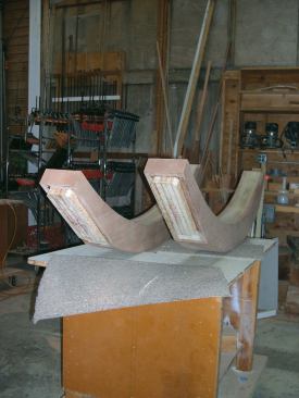 For ease of dry-bending, I had Dwyer plane the veneer lumber for the curve laminations to a 1/4-inch thickness. Using plenty of clamps, I epoxied the outer curves first. I also glued solid lumber to the ends of the braces to provide a weatherproof cap.