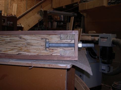 ... and passed another through the brace tenon at the bottom. I bedded all the tenons in thickened epoxy and screwed them from the back using 3 5/8-inch LedgerLok screws. For good measure, I also capped the bolts with a custom mix of sawdust and epoxy.