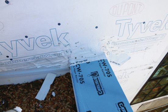 Using an adhesive especially helps on projects where it might be a while before the housewrap and flashing are covered up.