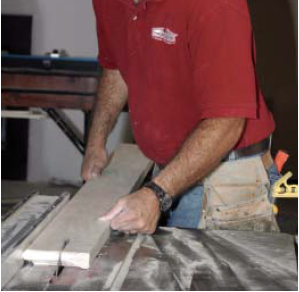 It helps to have the right tools: The author uses a table saw to cut the ears on the stool.