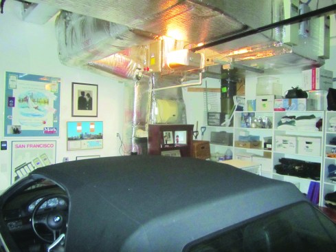 Air-conditioning ductwork in this garage was a setup for moisture condensation.