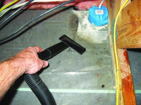 The author vacuumed up puddles of water from on top of the poly.