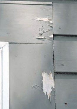 Here, carpenters have installed factory-primed window casing material without sealing the ends. Stain was applied without any sanding or repriming. Failure has begun at unprimed ends, flat grain, and unsealed knots.