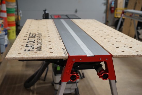 Table saw outfeed table with side supports.