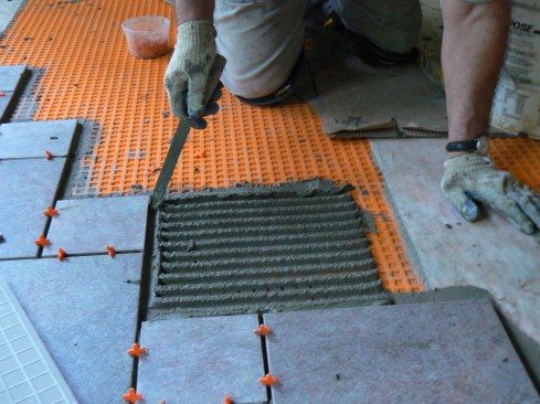 The author set the tile in unmodified thinset applied with a ½-inch-by-½-inch notched trowel.