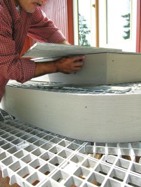 At the edges of the deck and the steps, the tiles needed to be scribed, then cut to fit with a wet saw.