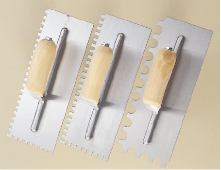 Notched trowels come in many configurations. Shown here, from left, are a 1/4x1/4-inch notch, for tiles up to 6 inches square, a 1/4x3/8-inch notch, for tiles up to 12 inches square, and a 3/4x9/16-inch U-notch, used for irregular handmade tiles.