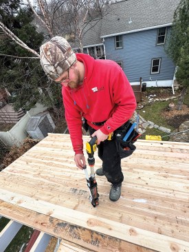 Fasteners load one at a time into a feeder tube on the side of the Timber Drive.