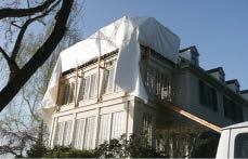 The builder's crew spent about a day assembling a frame to support the shrink-wrap film, which here has been draped over the work area but not yet stretched tight.