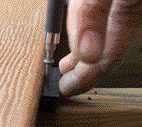 Figure 4. Depending on the product, composite decking may install more quickly than other options. Deck builders report that some hidden fastener systems, such as CorrectDeck's, actually speed installation, as well as provide a fastener-free look.