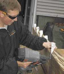 Figure 4. The person assigned to the cut station also assembles the beams, going so far as to lay them out and nail on the hurricane ties.