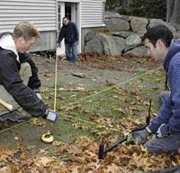 Figure 5. While one crew member starts cutting, others lay out the footings using a precalculated length for the diagonal measurement.