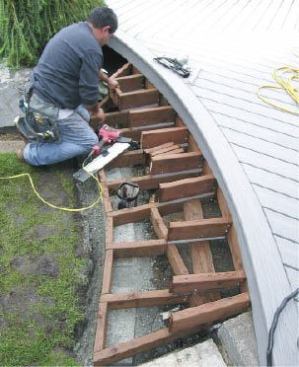 Figure 3. The upper joists of a box stair hang from a horizontal 2-by that in turn hangs from the bottoms of the deck joists.