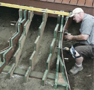 Figure 10. Thin deck fascia is shimmed out from the top and bottom of the diagonal jack to establish the flare.