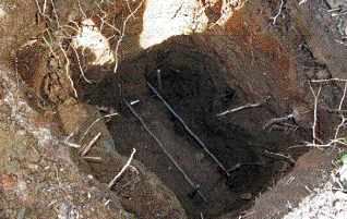 Figure 4. Footings for stacked decks need to be larger to support the increased loads. On sloping sites, special measures need to be taken to prevent the footing from sliding downhill; two such are digging a deeper footing, and digging the uphill side of the footing in deeper to provide a keyway.