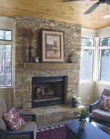 Figure 12. Even in the summer, a fireplace is this porch's focal point.