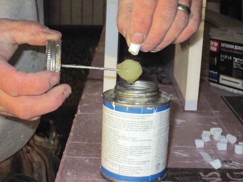 I dip each plug in PVC glue before tapping it into the hole.