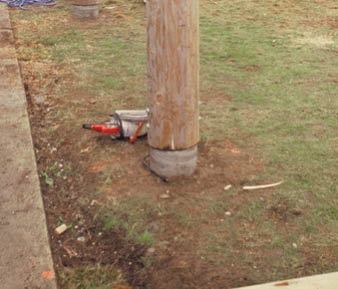 Figure 1. Log posts are vulnerable to rot from water wicking up the end grain. Sizing the portion of the footing that's above grade to be 2 inches smaller than the post provides a drip-edge. Keep the post at least 6 inches above grade to minimize the effect of rain splashing upward.