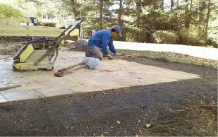Figure 1. Patios made from concrete pavers can add space to a backyard project at a fraction of the cost of a deck.
