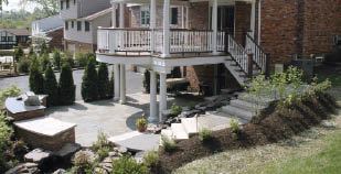 Figure 6. Plantings ease hard edges and blend decks and hardscaping into the yard. Photo by: Robert Viviano