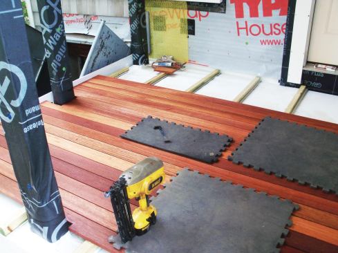 Once the completed membrane had been flashed and leak-tested, mahogany decking was fastened to tapered pressure-treated sleepers.