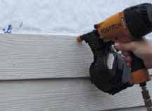 Figure 12. Fiber-cement siding is best installed with a nail gun. Otherwise, nail holes must be predrilled. In either case, set the nails flush with the face of the siding and no deeper.