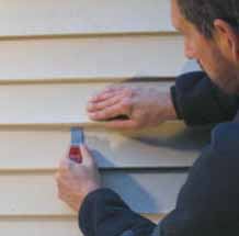 Figure 16. The zip-lock tool pulls the lip back down, and hand pressure following behind reseats the upper vinyl panel in the lower.