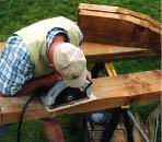 Figure 2. The back posts are laid out next to each other on 4x10 stock, minimizing waste. Cutting such thick material requires a 10-inch circular saw; the author will finish the cuts using a reciprocating saw.