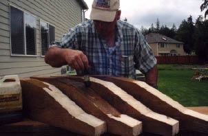 Figure 5. Cutting timbers usually exposes an untreated core. For longevity, coating all cuts in pressure-treated wood with an end-cut preservative is crucial.