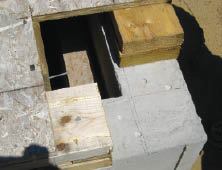 The moment frame begins at the foundation. MDO templates ensure that the holes in the column baseplates match the bolt holes in the concrete.