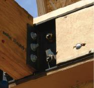 Bolt-on angle clips can support wood framing, as in the case of this LVL stairwell header.