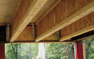 Wood cladding on the underside of the perimeter beam precluded the use of bolting flanges for the columns. Instead, they’re direct-welded.

