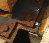 Stainless steel shims help plumb second-floor columns.