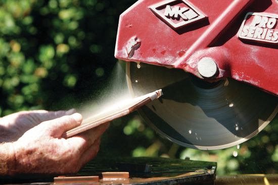 FREEHAND CUTTING WITH A WET SAW

Though not recommended by saw manufacturers (to limit their liability), freehand cutting can extend the flexibility and usefulness of a wet saw. Doing it safely depends on the installer’s steady hands resting firmly on the cutting table (10). Use both the edges and the sides of the blade for this type of cutting, and move the tile slightly side-to-side as you push it slowly into the blade. This movement widens the kerf and helps prevent the blade from pinching the tile and ripping it out of your hands, or — even worse — fracturing the rim of the blade and sending shrapnel flying into your face. Always use extreme caution, and always wear a full-face shield for any type of tile cutting.